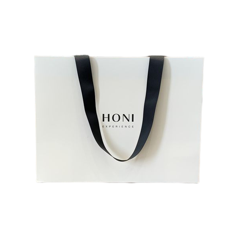 Borse regalo di lusso moda personalizzata Borsa di carta bianca Borsa per l'imballaggio per la spesa per i vestiti