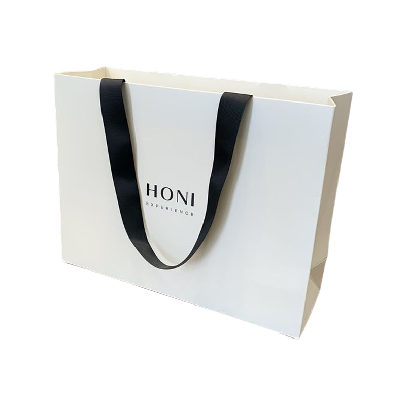 Borse regalo di lusso moda personalizzata Borsa di carta bianca Borsa per l'imballaggio per la spesa per i vestiti